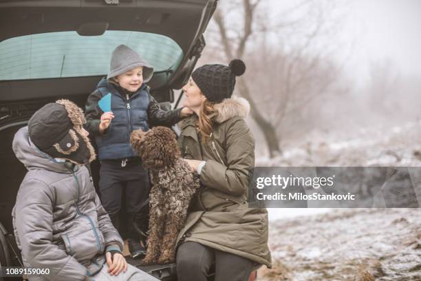 happy family on a winter day - winter road trip stock pictures, royalty-free photos & images