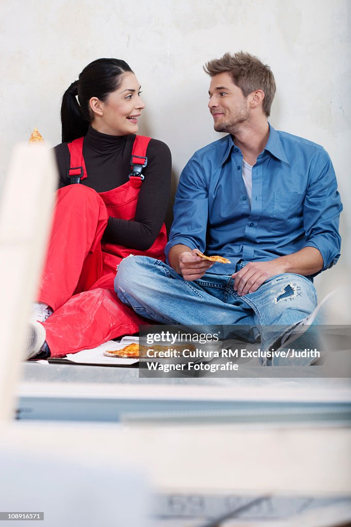 Couple eating pizza