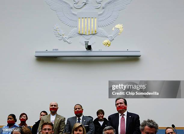 Demonstrators who support a woman's right to choose abortion stand in silence during a hearing of the House Judiciary Committee's Subcommittee on the...