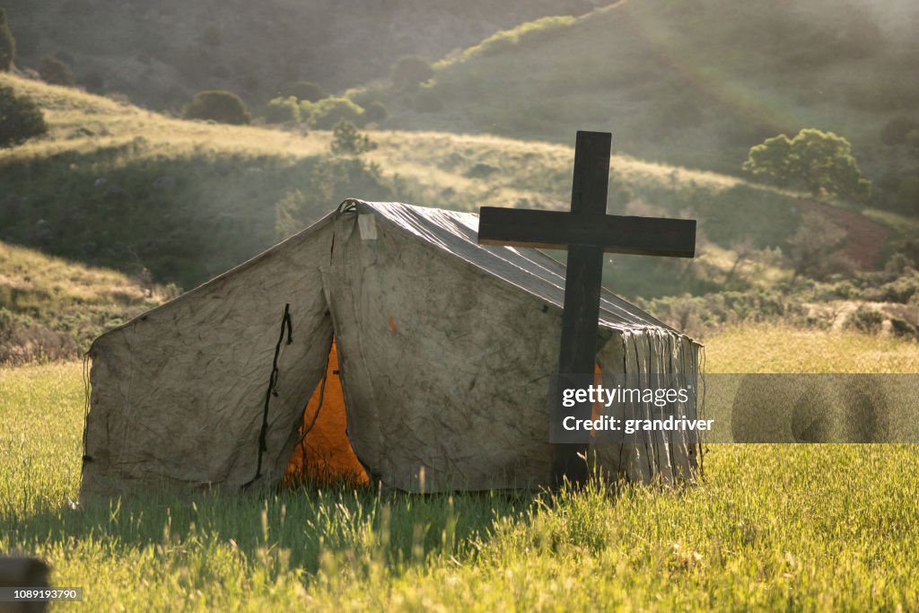 The Sun Rise Behind A Christian Tent Chapel Out In A Field For Cowboys To Attend