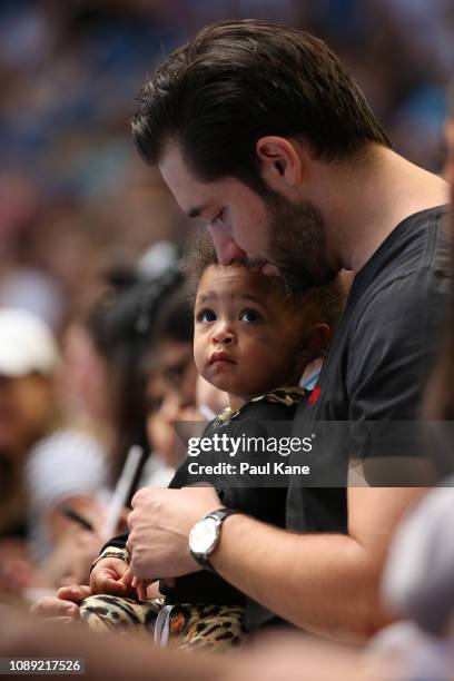 Serena Williams' husband Alexis Ohanian sits court side with their daughter Alexis Olympia Ohanian Jr. During the women's singles match between...