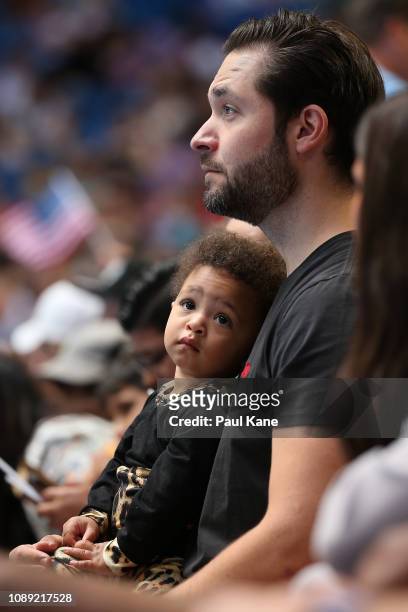 Serena Williams' husband Alexis Ohanian sits court side with their daughter Alexis Olympia Ohanian Jr. During the women's singles match between...
