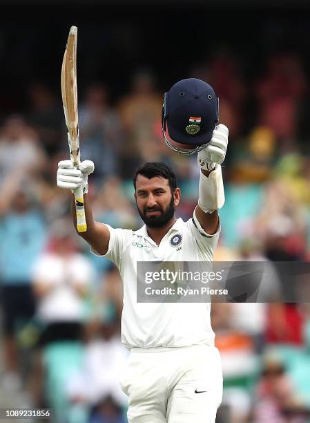 Cheteshwar Pujara of India celebrates after reaching his century during day one of the Fourth Test match in the series between Australia and India at...