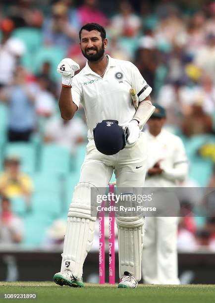Cheteshwar Pujara of India celebrates after reaching his century during day one of the Fourth Test match in the series between Australia and India at...
