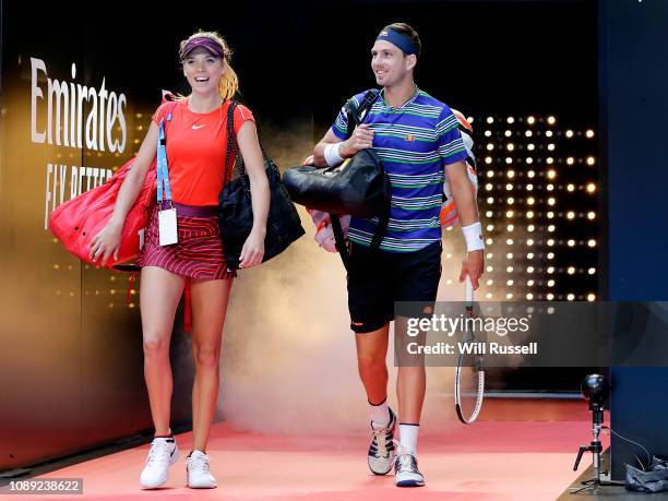 Katie Boulter and Cameron Norrie of Great Britain walk onto court for the mixed doubles match against Serena Williams and Frances Tiafoe of the...