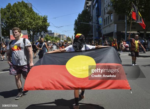 Australian Aborigines and their supporters stage a protest against Australia Day, which was the day the first fleet pulled into Sydney Cove and...