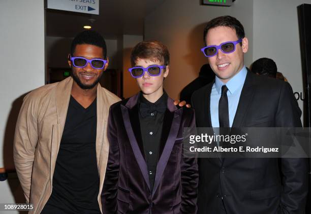 Producer Usher, singer Justin Bieber and producer Scooter Braun arrive arrives at the premiere of Paramount Pictures' "Justin Bieber: Never Say...