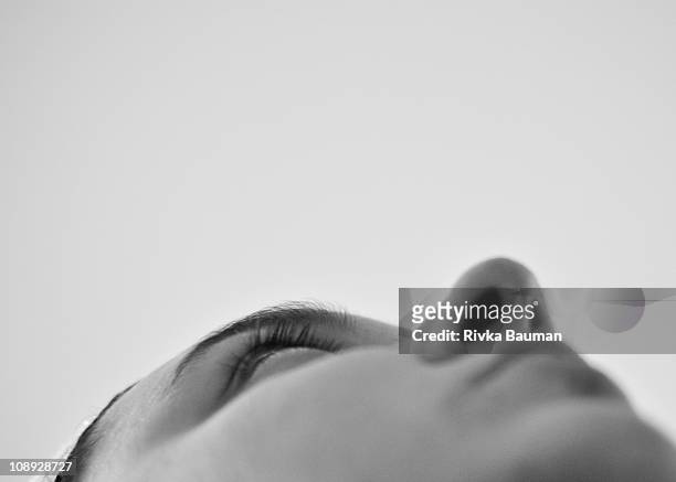 black and white, woman gazing off to the distance - heads looking up stock-fotos und bilder
