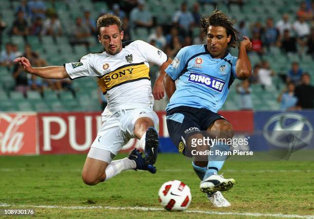 Nick Carle of Sydney FC scores his teams first goal past Nick Ward of the Phoneix during the round 26 A-League match between Sydney FC and Wellington...