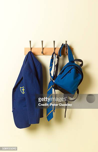 school blazer and bag on coat rack - school uniform stock pictures, royalty-free photos & images