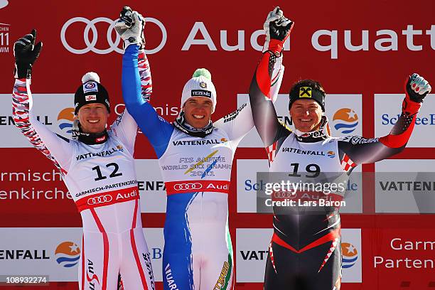 First placed Christof Innerhofer of Italy, second placed Hannes Reichelt of Austria and third placed Ivica Kostelic of Croatia celebrate at the...