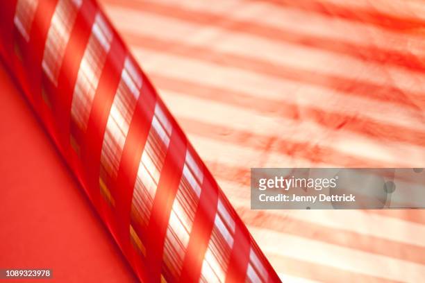red-stripe cellophane - roll of wrapping paper stock pictures, royalty-free photos & images