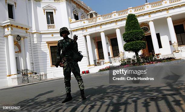 An Egyptian Army soldier guards the Egyptian Parliament building on February 9, 2011 in Cairo, Egypt. Thousands of Egyptians protested outside of the...