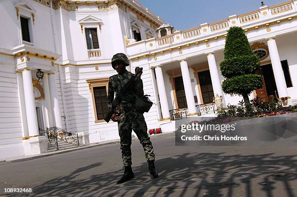 An Egyptian Army soldier guards the Egyptian Parliament building on February 9, 2011 in Cairo, Egypt. Thousands of Egyptians protested outside of the...