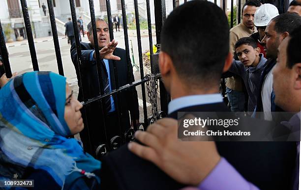 An Egyptian official tries to calm a group of anti-government protesters demonstrating outside the Ministry of Health building on February 9, 2011 in...