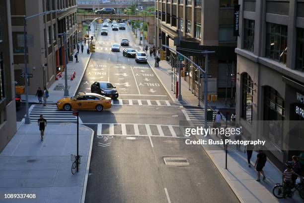 view from above of traffic in streets of dumbo, brooklyn, new york city, usa - road intersection stock-fotos und bilder
