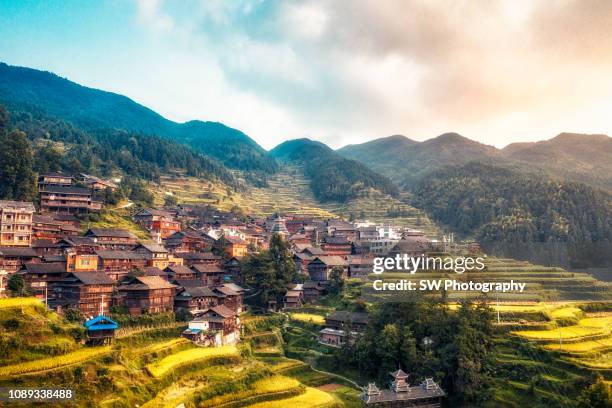 gorgeous sunset view of an old chinese village - terraced field stock pictures, royalty-free photos & images