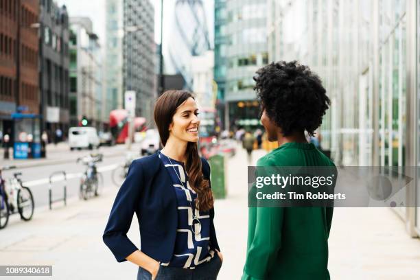 two women talking and smiling in city - london 2018 day 2 bildbanksfoton och bilder