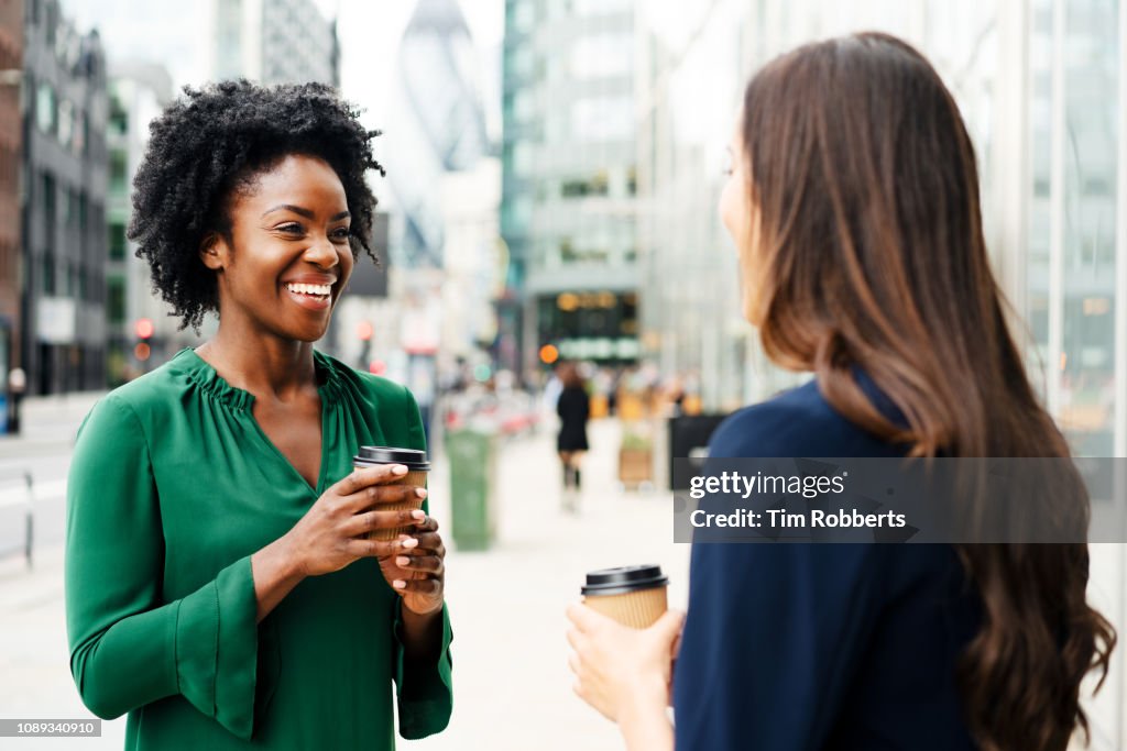 Woman sharing coffee together