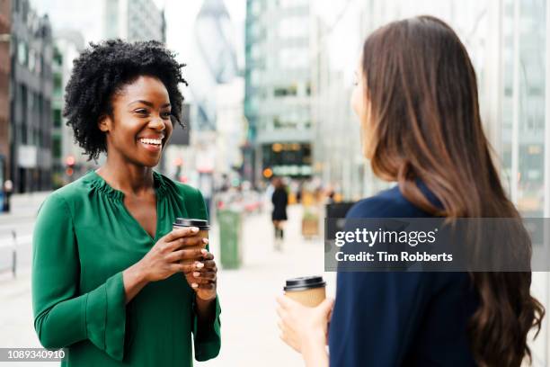 woman sharing coffee together - coffee outside bildbanksfoton och bilder