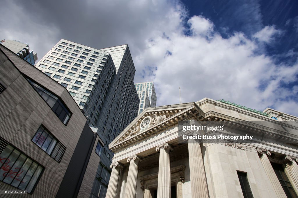 Highrise office tower and neoclassical building at Albee Square by the Fulton Street Mall in Fort Greene, Brooklyn, New York City