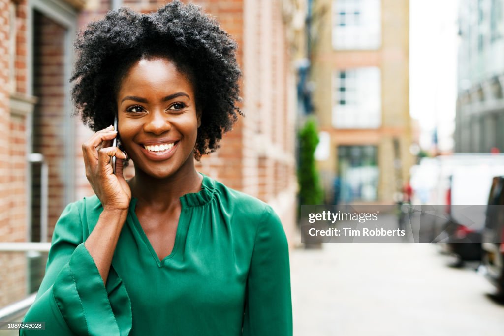 Woman on smart phone, smiling