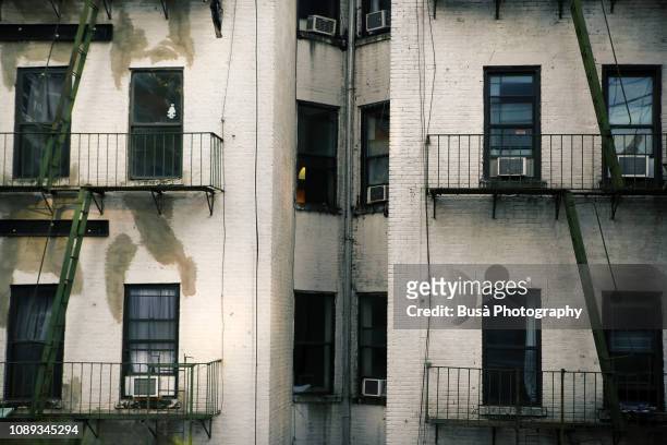 rear facade of tenement in the lower east side, manhattan, new york city - run down neighborhood stock pictures, royalty-free photos & images