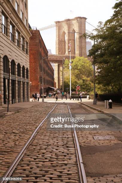 tracks of former streetcar in dumbo, brooklyn, new york city - brooklyn street stockfoto's en -beelden