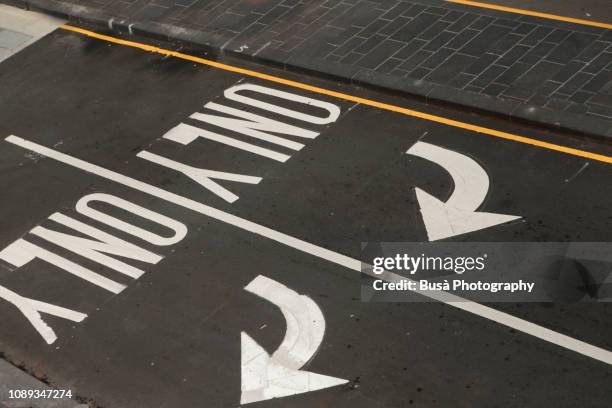 "only" road marking on street in new york city, usa - links platz stock-fotos und bilder