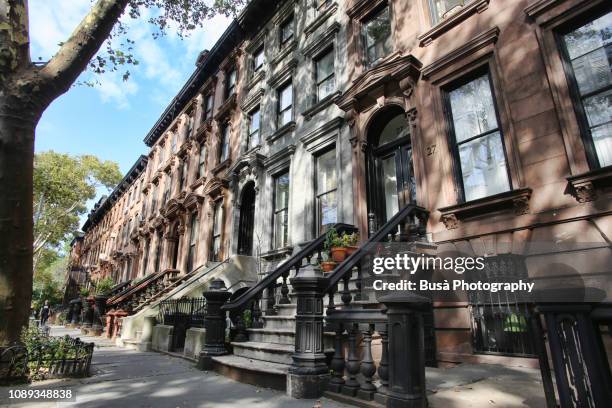 row of brownstones in new york city - west village stock pictures, royalty-free photos & images