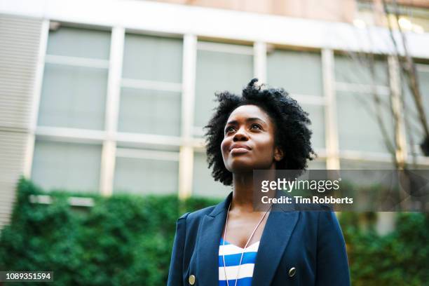 woman looking up - role model stock pictures, royalty-free photos & images