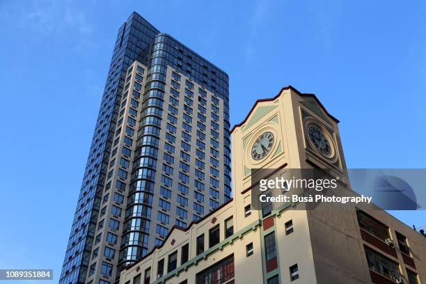 old clock tower with modern highrise condominium tower in the background in brooklyn, new york city - brooklyn new york stock pictures, royalty-free photos & images