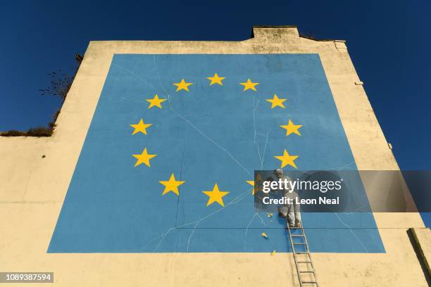 Painting depicting a workman chipping away at a star on the EU flag by artist Banksy is seen on January 03, 2019 in Dover, England. The port town of...