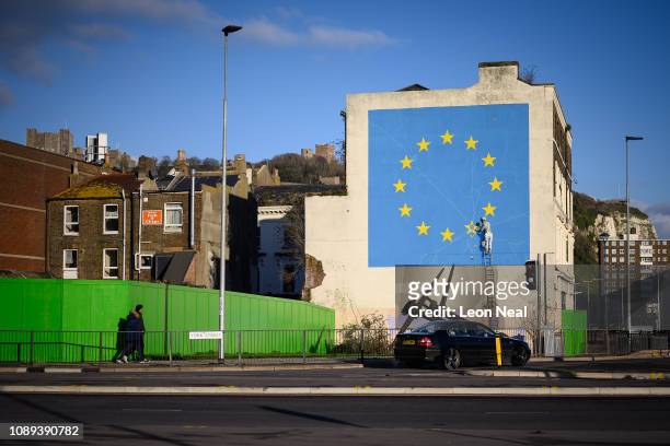 Painting depicting a workman chipping away at a star on the EU flag by artist Banksy is seen on January 03, 2019 in Dover, England. The port town of...