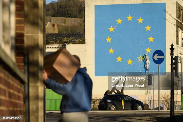 Painting depicting a workman chipping away at a star on the EU flag by artist Banksy is seen on January 03, 2019 in Dover, England. The port town of...