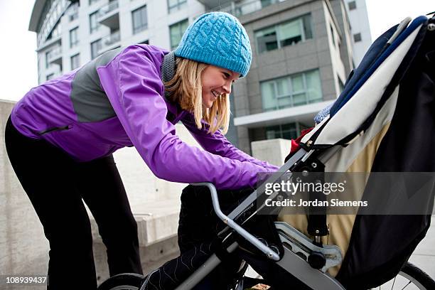 woman having fun with your young child. - family sports centre laughing stock pictures, royalty-free photos & images