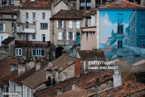 Picture shows a mural entitled "La fille des remparts" after a drawing by French comic artist Max Cabanes in Angouleme, western France, on January 26...