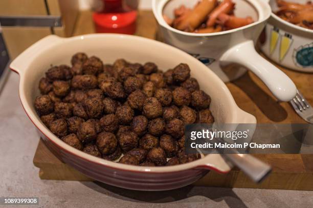 swedish meatballs (köttbullar) on julbord, christmas table, sweden - julbord stock pictures, royalty-free photos & images