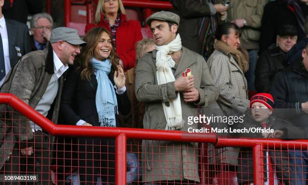 London - Football League 2 - Brentford v Port Vale - Singer Robbie Williams watching the match with girlfriend, actress Ayda Field -