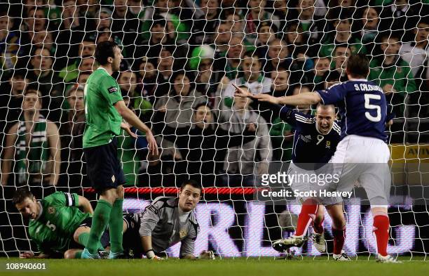 Kenny Miller of Scotland celebrates after scoring their first goal during the Carling Nations Cup match between Northern Ireland and Scotland at the...