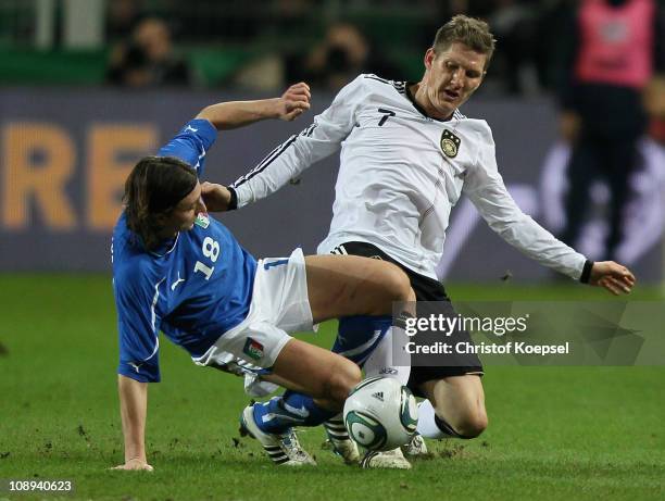 Riccardo Montolivo of Italy challenges Bastian Schweinsteiger of Germany during the International Friendly match between Germany and Italy at Signal...