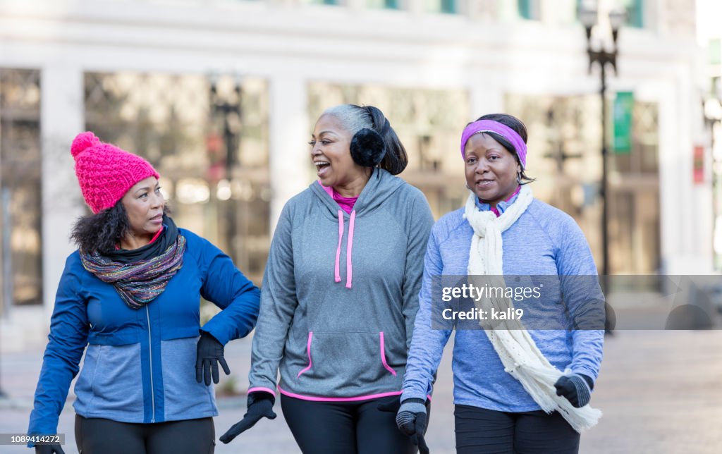 Mature African-American women in city, walking, talking