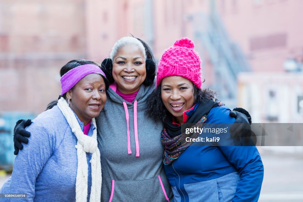 African-American women in city, smiling at camera