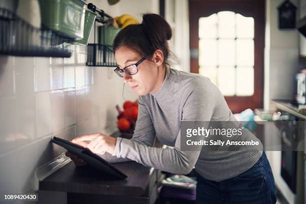 Woman using a smart tablet for smart home devices