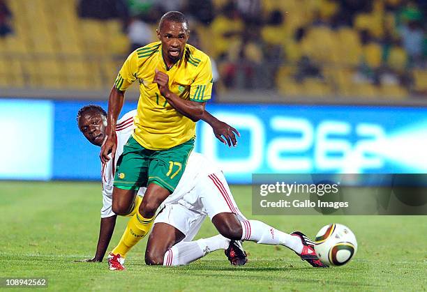 Bernard Parker of Kenya and Kevin Omondi of South Africa compete during the International friendly match between South Africa and Kenya at Royal...