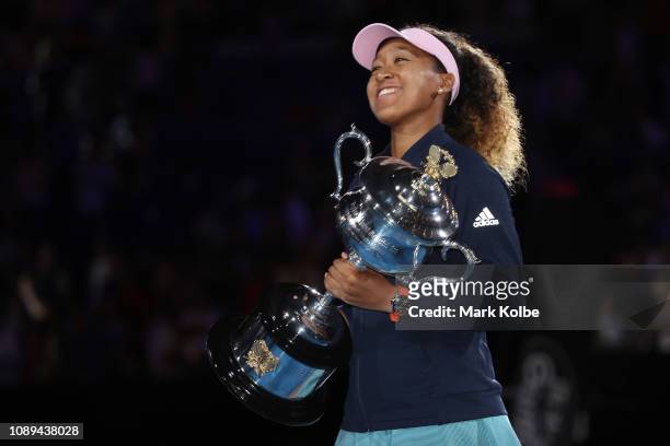 Naomi Osaka of Japan poses for a photo with the Daphne Akhurst Memorial Cup following victory in her Women's Singles Final match against Petra...