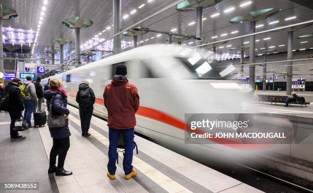 An Inter-City Express train of the Deutsche Bahn pulls into Berlin's main railway station on January 25, 2019