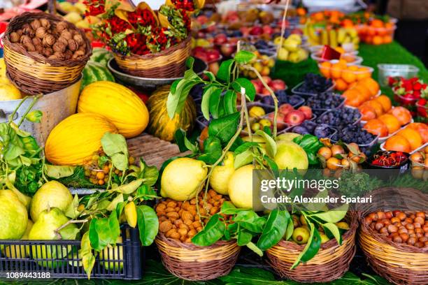 variation of fresh fruits and vegetables on market stall at campo di fiori market in rome, italy - campo de fiori stock pictures, royalty-free photos & images