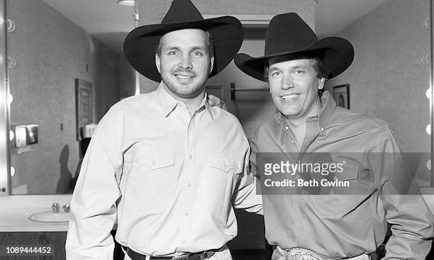 Country Music Singer Garth Brooks and George Strait back stage at the Grand ole Opry house March 7,1991 in Nashville, Tennessee.