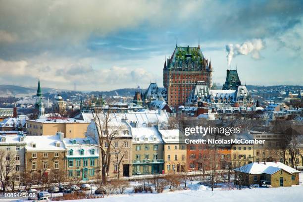elevated view of the quebec city skyline during partially sunny winter day - winter quebec stock pictures, royalty-free photos & images